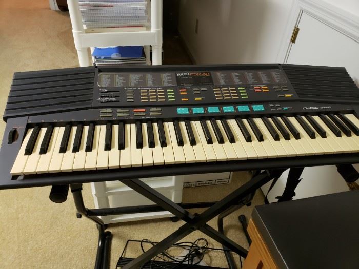Yamaha keyboard and stand.
