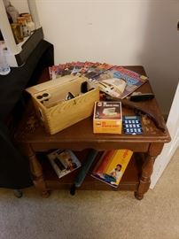 End table, microscope, magazines. 