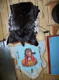 Indian painting on hide and black hide.