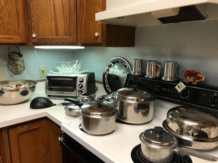 Kitchen getting set up, pots pans, Pyrex, sunbeam mixer, toaster oven....