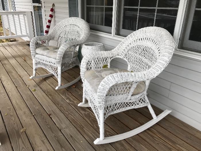 Pair of white wicker rocking chairs