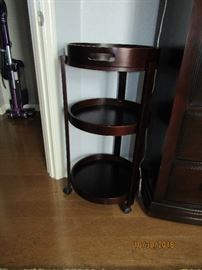 SMALL END TABLE WITH 3 SHELVES AND THE TOP COMES OFF AS A SERVING TRAY