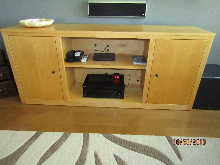 CONTEMPORARY CREDENZE.. IT IS CALLED "ROOM AND BOARD" 70X17X30 2 SIDES WITH ADJUSTABLE SHELVES, CENTER IS ONE ADJUSTABLE SHELF.. HOLDS A LOT OF ELECTRONIC EQUIPMENT.. HOLES RE ALREADY PRE-DRILLED FOR NO MESS.. 