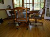 Kitchen Table with Leaf and 4 rolling chairs.
