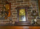 Vintage and Antique Oil Lamps and an Old Mantel Clock