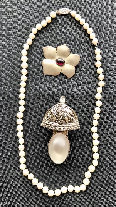 Pearl Necklace, Sterling E. Levine Flower Pin, and Rebecca Collins Slide