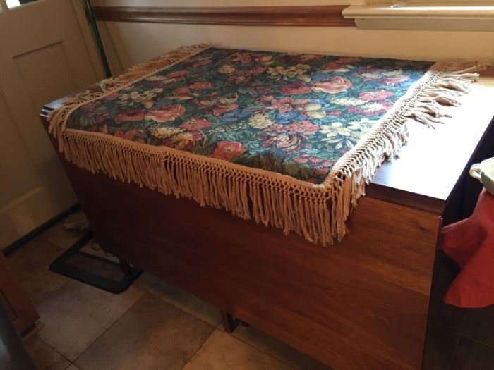 Kohr Brothers drop-leaf table and decorative cloth.