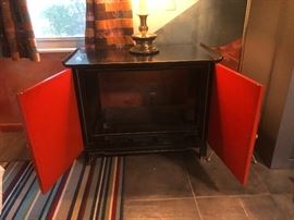 1960s Asian Modern Black & Asian Red Lacquered Cabinet Oriental Relief Bi-Fold Doors Rolled Edge Gold Accent Brass Caps. TV has been removed.
It was given as a Christmas gift from  Senator Barry Goldwater  
