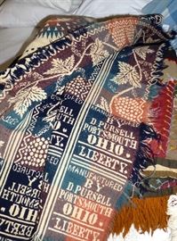 One of two antique jacquard coverlets