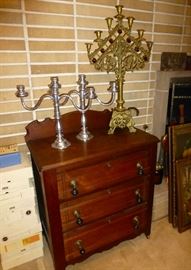 The brass church candelabra has purple jewels and has been upgraded to the living room