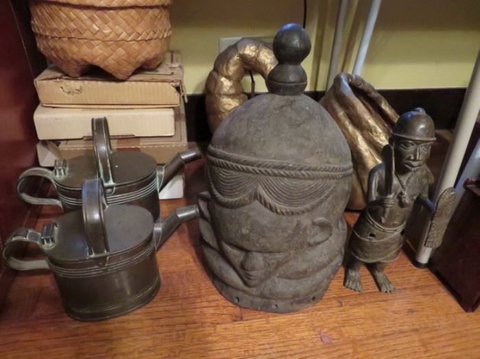 African helmet mask, copper watering cans