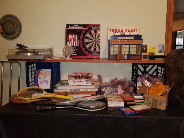 Vintage games, tennis rackets, and cards.
