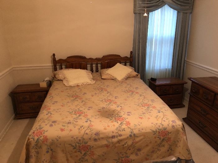 $500.  5 piece Queen bedroom suite.  Headboard, two bedside tables, dresser with mirror, and chest of drawers.  there is a shadow on the bed from the light fixture, it's not a stain.