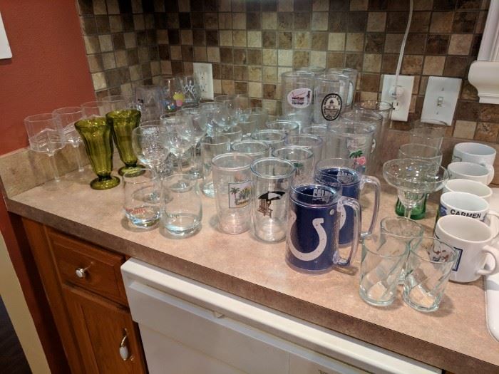 Large selection of Tervis cups and various glassware