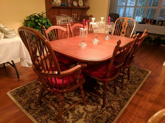Dining table seats 6 as pictured. Also includes custom fit table pads and 2 leafs