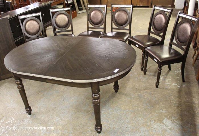 Contemporary Modern Design 7 Piece Dining Room Set with 6 Medallion Padded Chairs and Stainless Steel Accents with Leaf
Located Inside – Auction Estimate $300-$600