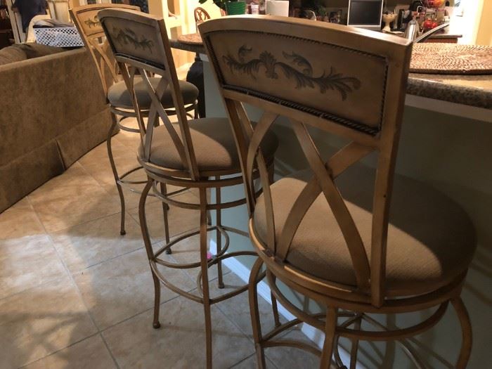 Three barstools that swivel 360°, hand painted vine, tan cotton covered seats, 47" bar stool height.