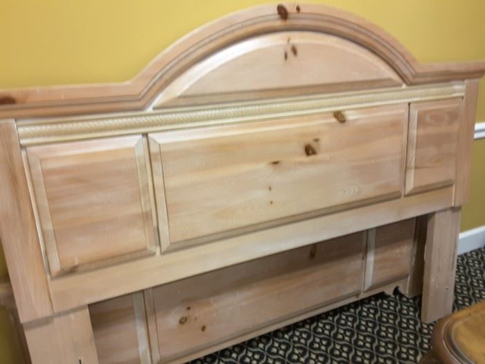 Queen size bed in a light distressed Pine finish.