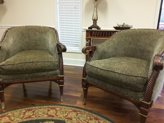 This pair of upholstered barrel back chairs are exquisite!
