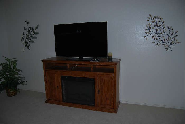 RCA 50" FLAT SCREEN TELEVISION, MEDIA STAND WITH FIREPLACE, METAL WALL DECOR
