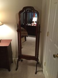Wooden swivel mirror that matches bedroom furniture
