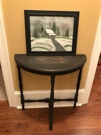 A small vintage table with an original oil of a winter scene