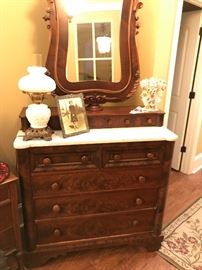 Gorgeous Antique ladies dresser.  Well made and beautiful too. White marble with a nice bevel adorns the top of the chest with a swivel mirror