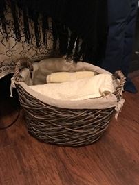 a neat basket filled with nice towels for your home