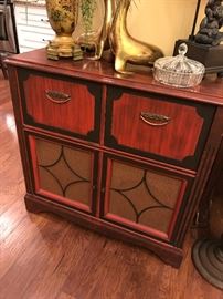 interesting look. a former stereo cabinet that would make a great bar. fun  vintage stained wood