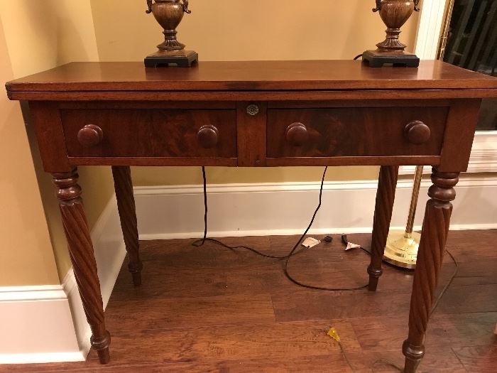beautiful well made table. check out the twist in the legs. the great drawers and it is a drop leaf too. great when you need an extra table for dining or a game.
