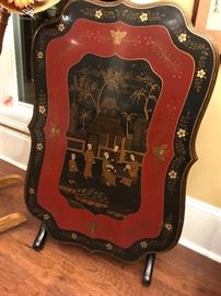 beautiful lacquer Oriental tilt top table. black legs. Works well as a coffee table or end table. Stands up nicely and would make a great fire screen too