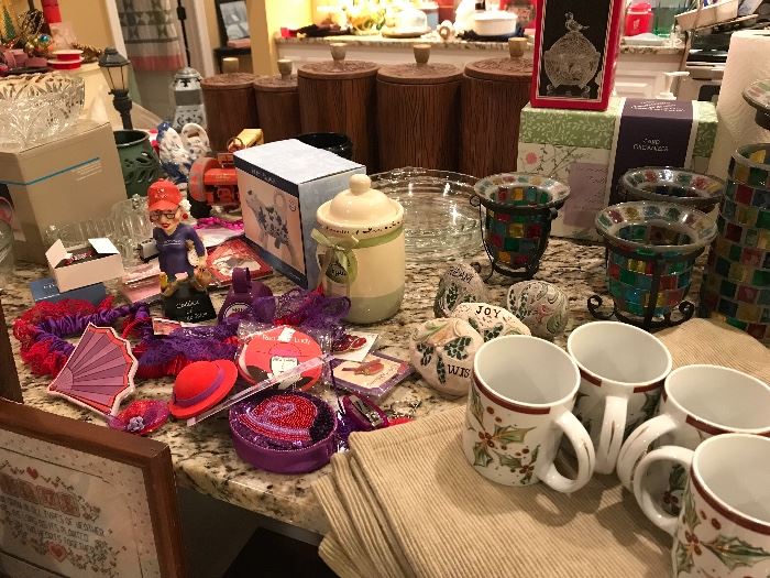 a large collection of red hat items and some great holiday mugs