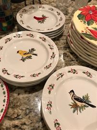 beautiful birds on plates with holly berries