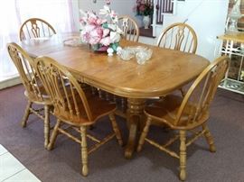 Solid oak dining table and chairs