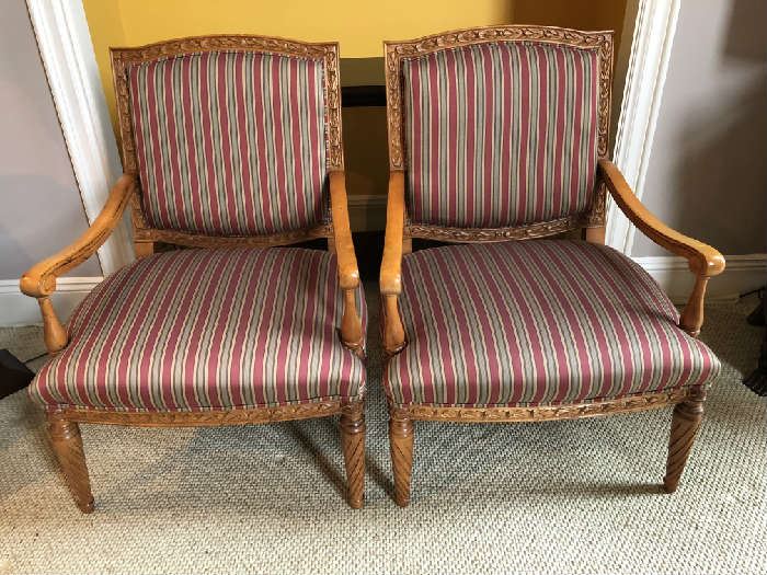 Pair French style upholstered arm chairs with highly carved wood frame