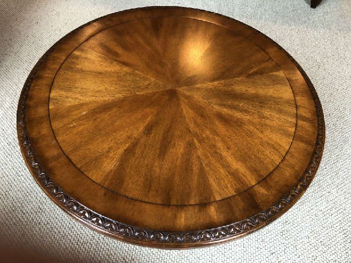 Large round low carved pedestal table with paw foot 
