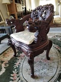 4 identical chairs with intricate chinese wood carvings