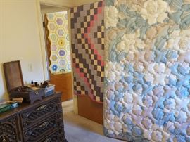 The family has decided to keep the two quilts shown in this picture.