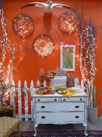 "Snowflakes" on wall made from hanging metal baskets!  