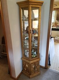 Lighted, mirrored curio cabinet 