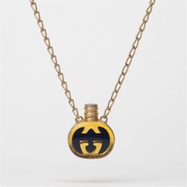 64: VINTAGE GUCCI PERFUME BOTTLE NECKLACE WITH EAU DE TOILETTE ROCHAS