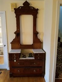 Bureau with marble top and mirror frame.