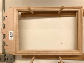 Fleur de lis mirror frame in tiger maple, unfinished