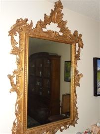 Large ornate wall mirror framed