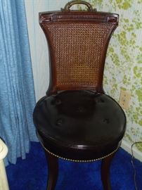 Black round bottom cane back chair no rips or tears
