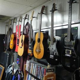A nice collection of acoustic and electric guitars.