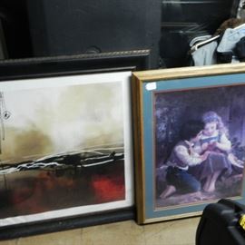 Many wall hangers and nice pieces of artwork in frames.   