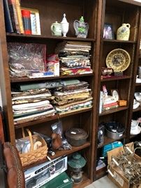 Material remnants, vintage camping equipment, vintage cookbook