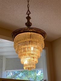 Antique five tier crystal chandelier.  