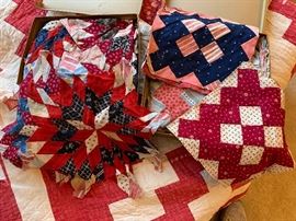 Two small boxes of antique hand stitched quilt blocks
